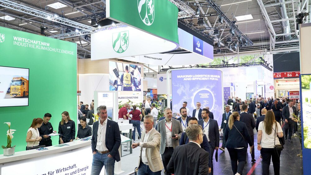 Visitors and exhibition stands in hall B5 at transport logistic 2025